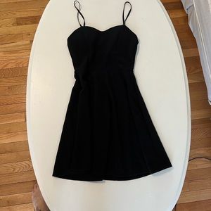 Black Noble U sleeveless dress. Adjustable straps. Padded chest. C12